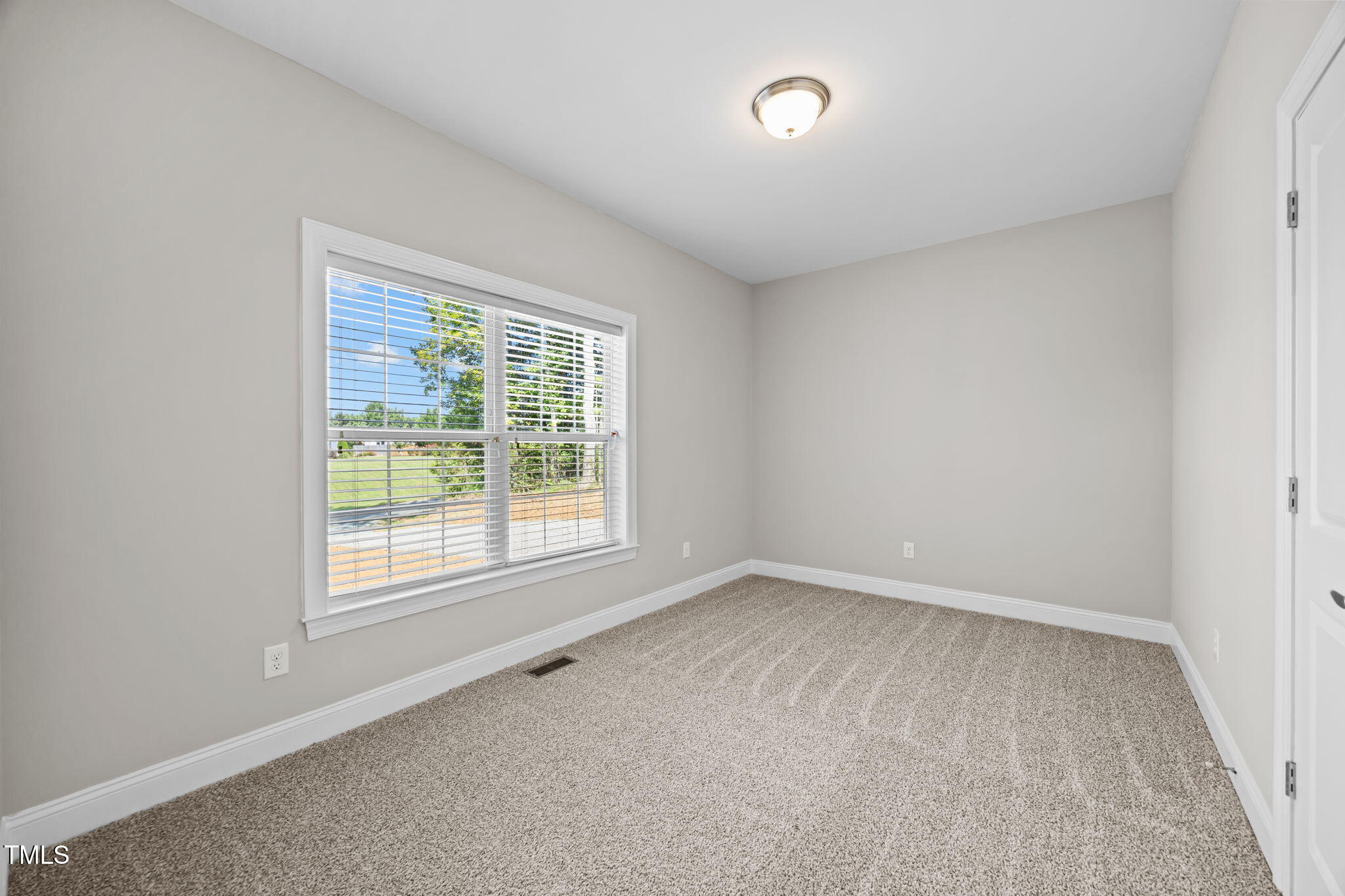 6117 David Moore Road Burlington, NC 27217 - Photo 32 of 51 an empty room with a window