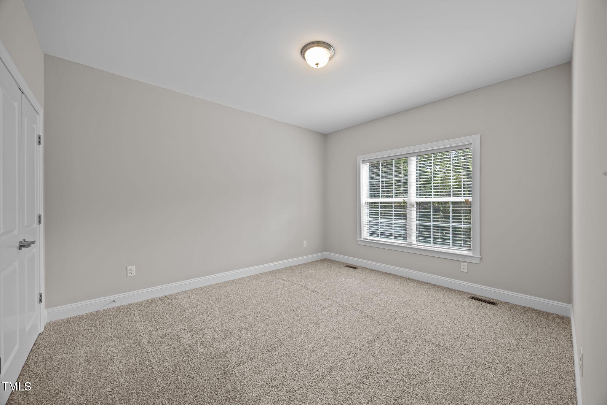 6117 David Moore Road Burlington, NC 27217 - Photo 34 of 51 an empty room with a window