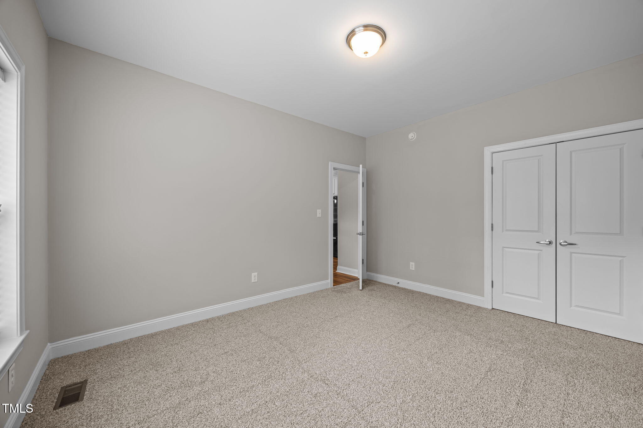 6117 David Moore Road Burlington, NC 27217 - Photo 35 of 51 an empty room with closet area