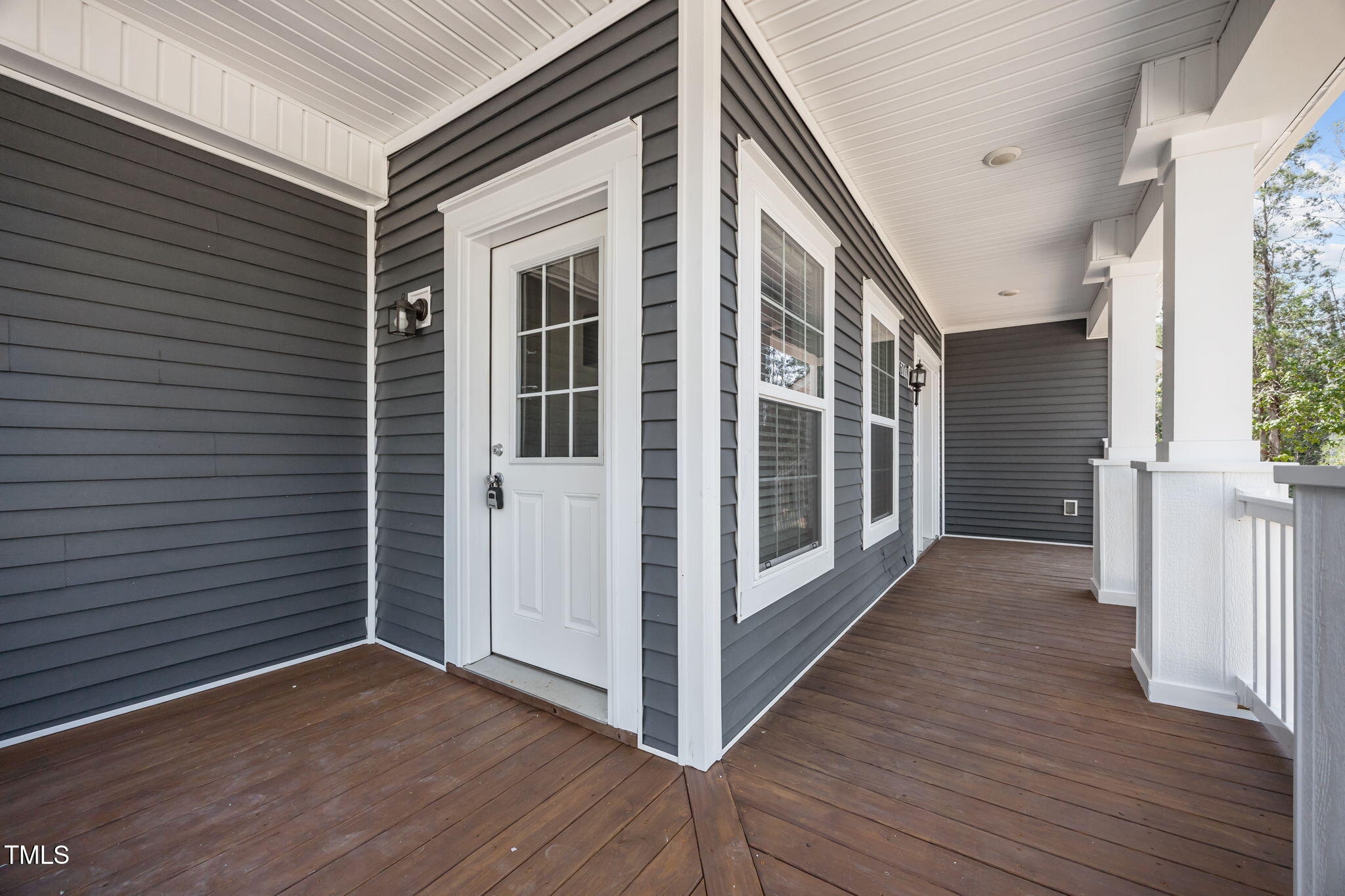 6117 David Moore Road Burlington, NC 27217 - Photo 50 of 51 a view of a balcony with wooden floor and stairs