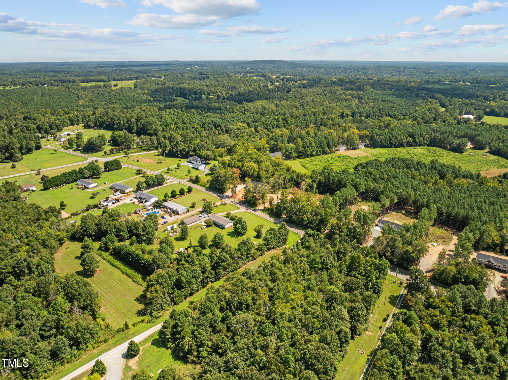 6117 David Moore Road Burlington, NC 27217 - Photo 51 of 51 an aerial view of residential houses with outdoor space and trees
