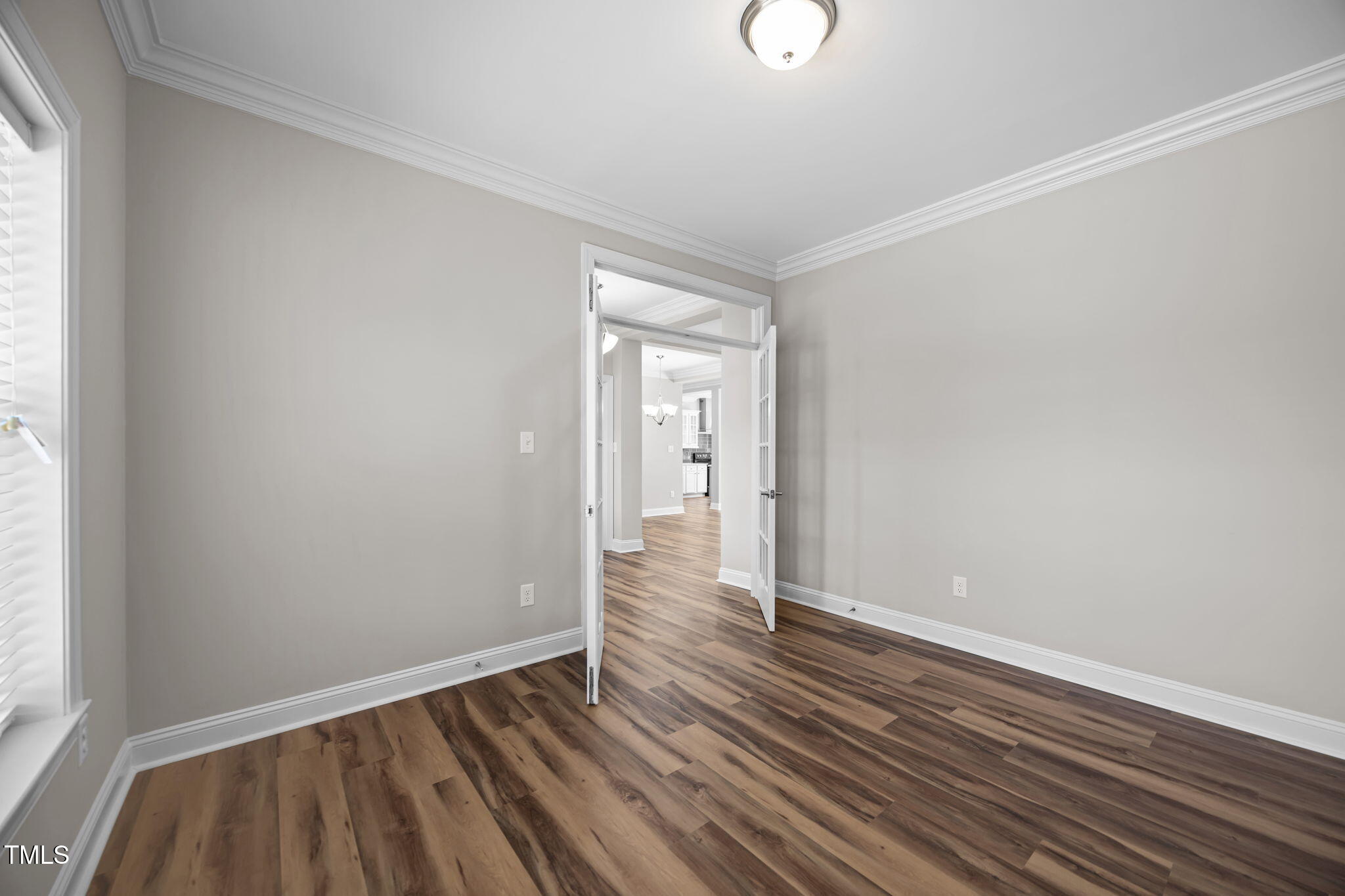 6117 David Moore Road Burlington, NC 27217 - Photo 10 of 51 an empty room with wooden floor and windows