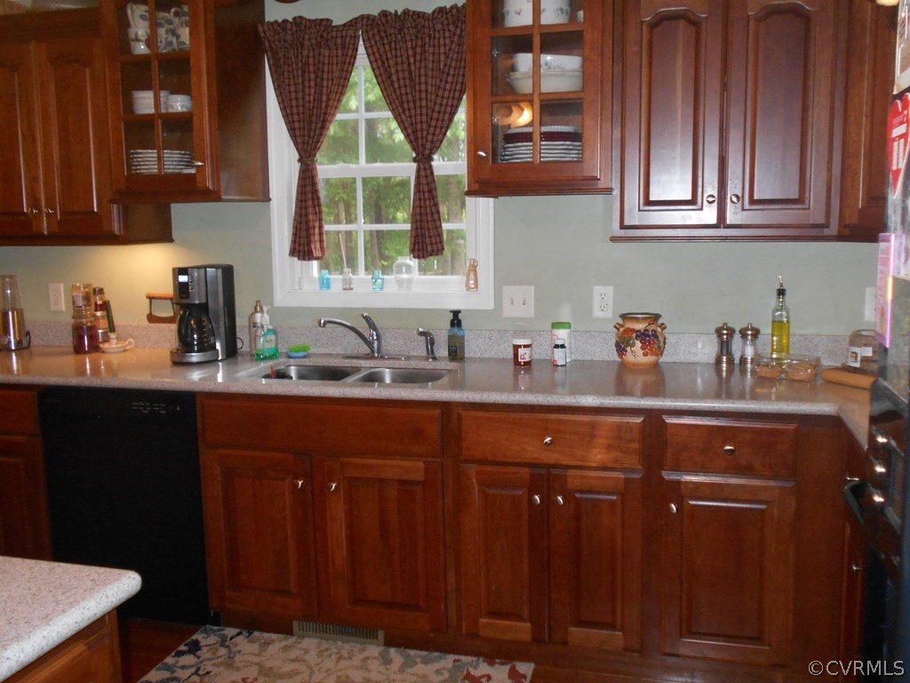 1925 Hill Cross Road Charlotte Court House, VA 23923 - Photo 12 of 50 a kitchen with stainless steel appliances granite countertop wooden cabinets a sink and dishwasher