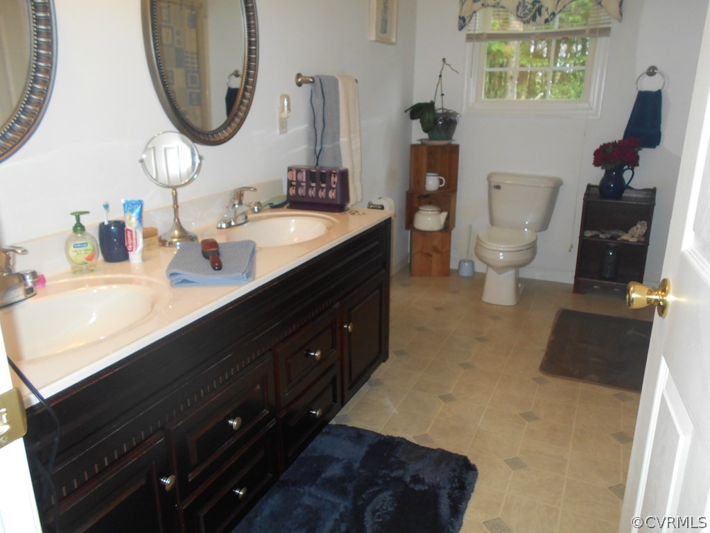 1925 Hill Cross Road Charlotte Court House, VA 23923 - Photo 19 of 50 a bathroom with a sink and a mirror