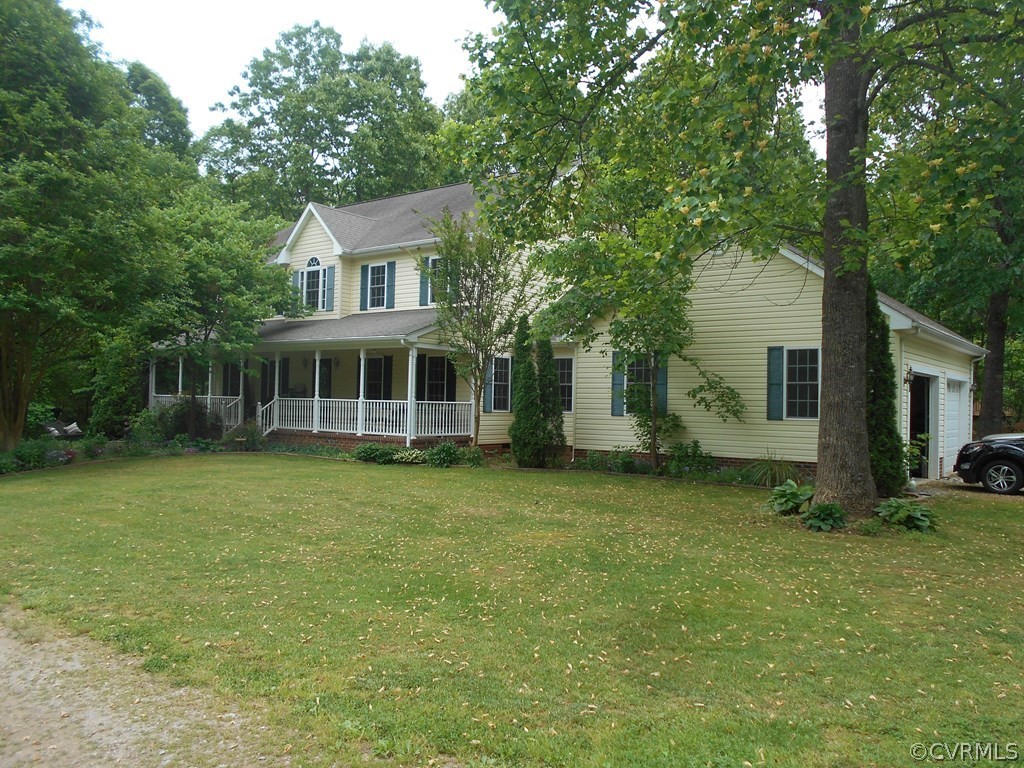 1925 Hill Cross Road Charlotte Court House, VA 23923 - Photo 34 of 50 a front view of a house with a garden