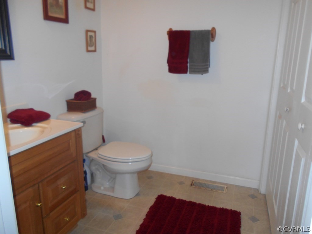 1925 Hill Cross Road Charlotte Court House, VA 23923 - Photo 6 of 50 a bathroom with a toilet and a sink