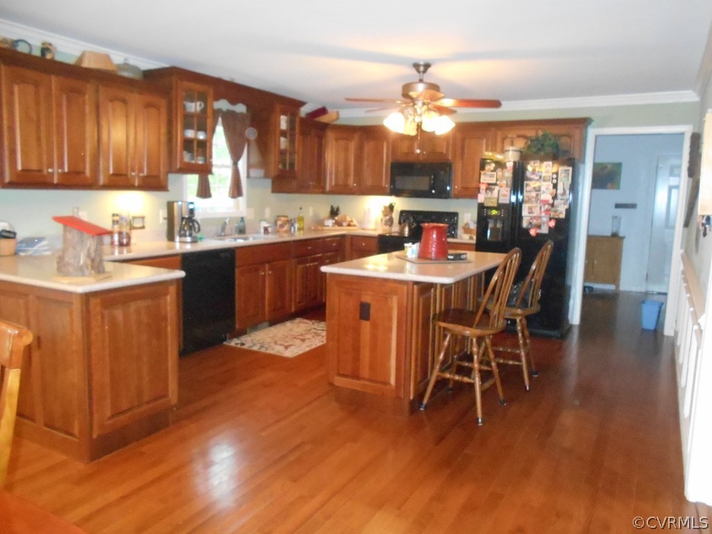 1925 Hill Cross Road Charlotte Court House, VA 23923 - Photo 7 of 50 a kitchen with stainless steel appliances granite countertop a table chairs sink and cabinets