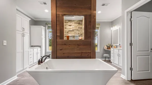 a bathroom with a bathtub and window