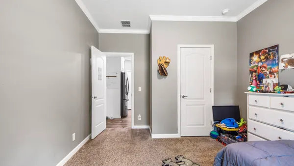 a bedroom with a bed and furniture