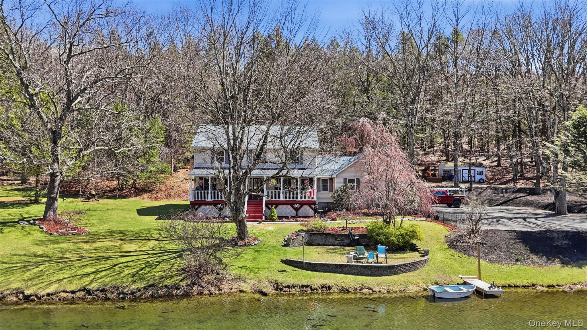 1285 Lakes Road Monroe, NY 10950 - Photo 39 of 45 a swimming pool with outdoor seating and yard