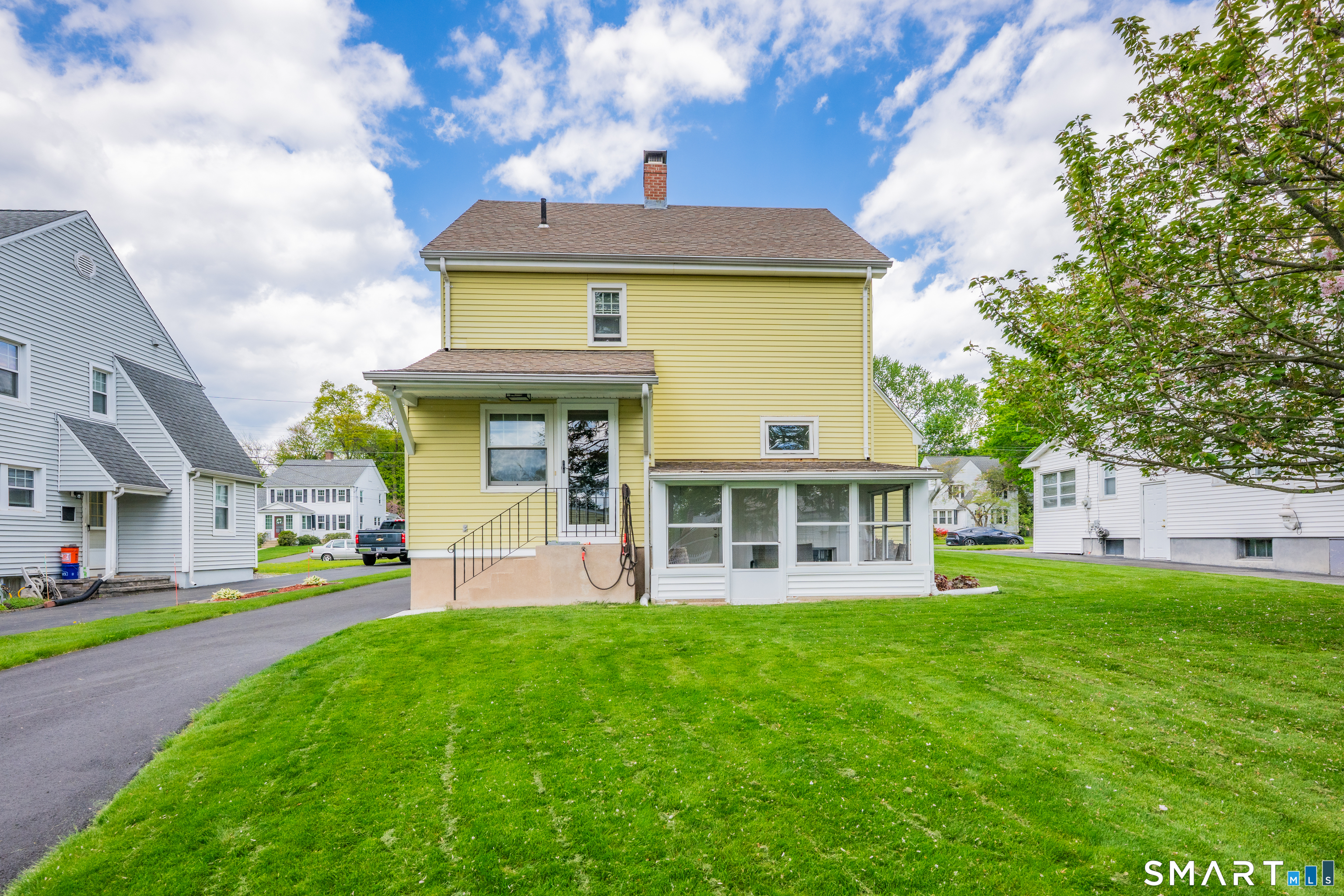 44 Beverly Road Wethersfield, CT 06109 - Photo 24 of 31 a front view of a house with a yard and entertaining space
