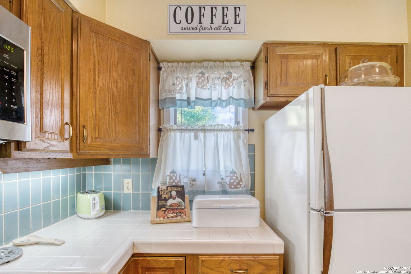 805 Highway 534 Loop, Unit 122 Kerrville, TX 78028 - Photo 11 of 30 a kitchen with a refrigerator and a sink