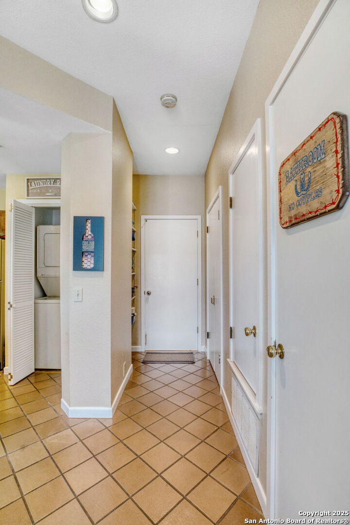 805 Highway 534 Loop, Unit 122 Kerrville, TX 78028 - Photo 13 of 30 a view of a hallway with bathroom