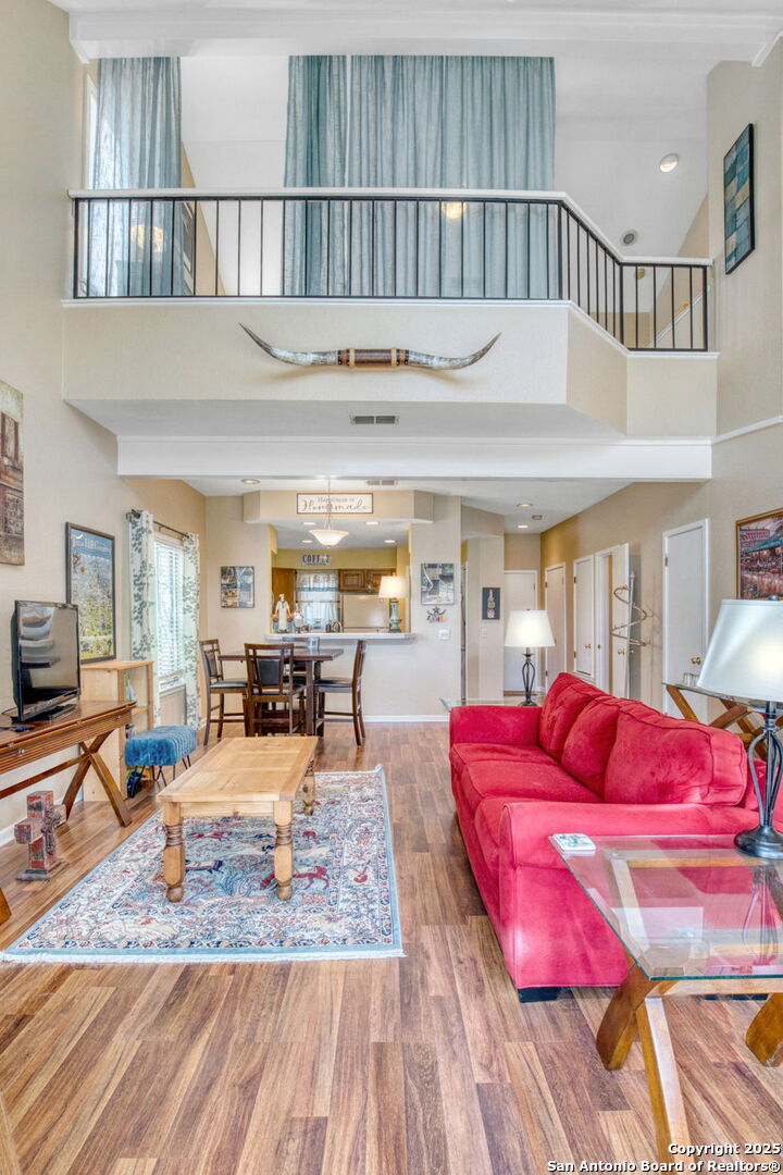 805 Highway 534 Loop, Unit 122 Kerrville, TX 78028 - Photo 16 of 30 a living room with furniture a rug and a flat screen tv