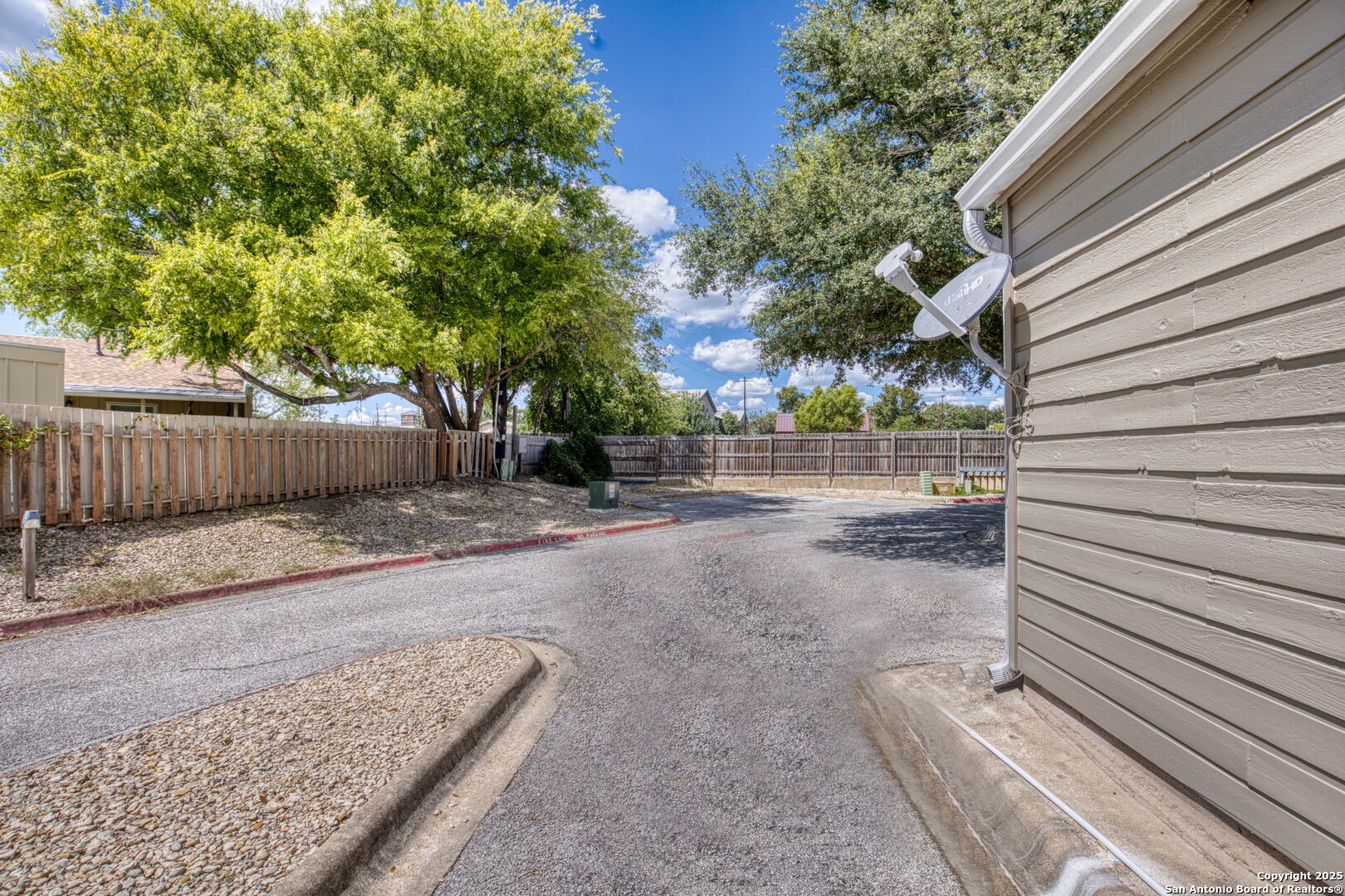 805 Highway 534 Loop, Unit 122 Kerrville, TX 78028 - Photo 20 of 30 a view of a backyard with wooden fence