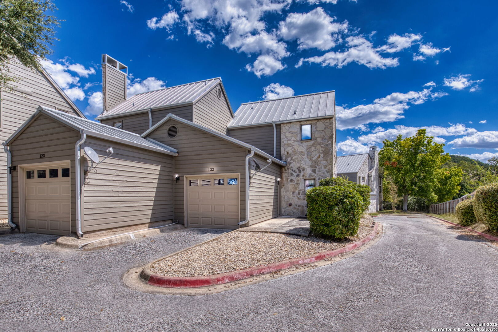 805 Highway 534 Loop, Unit 122 Kerrville, TX 78028 - Photo 21 of 30 a view of a house with a garage