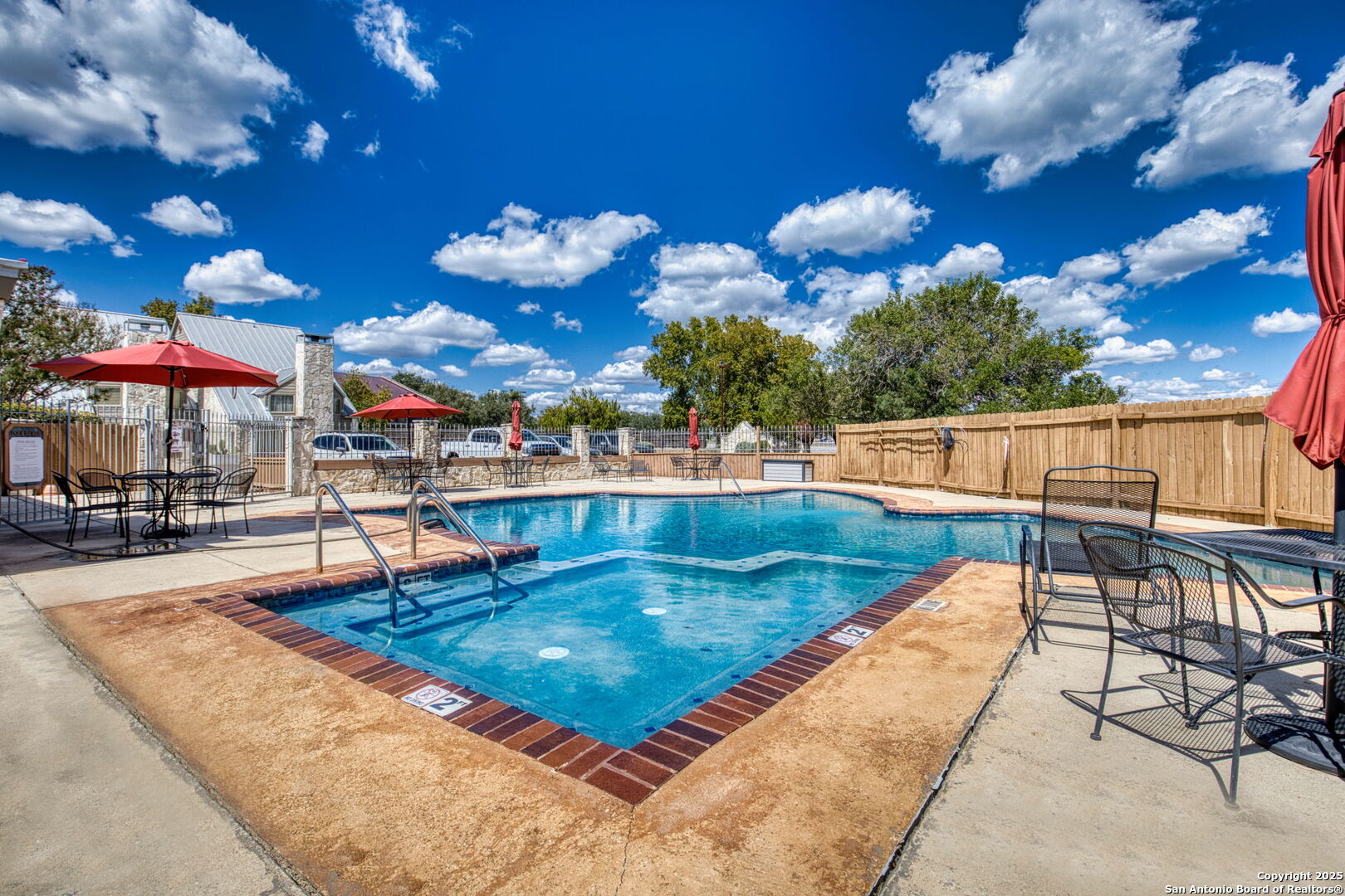805 Highway 534 Loop, Unit 122 Kerrville, TX 78028 - Photo 23 of 30 a view of a swimming pool with a patio