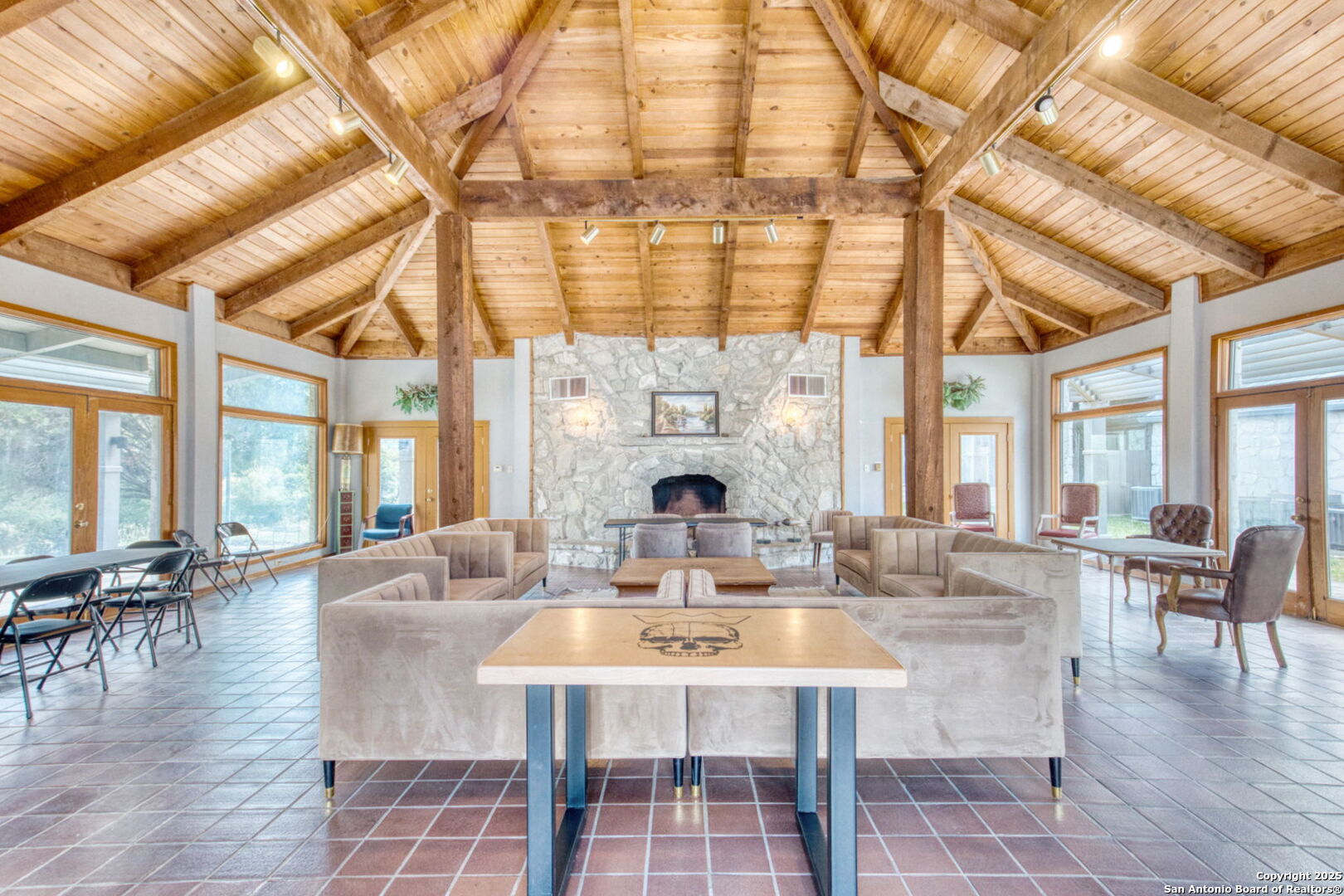805 Highway 534 Loop, Unit 122 Kerrville, TX 78028 - Photo 25 of 30 a living room with fireplace furniture and a large window