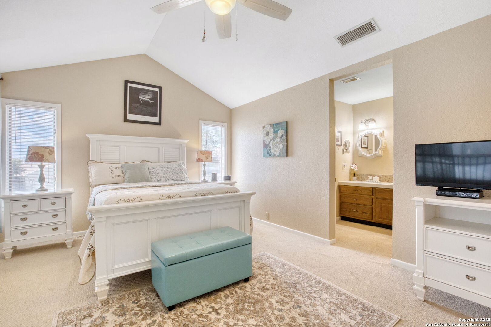 805 Highway 534 Loop, Unit 122 Kerrville, TX 78028 - Photo 5 of 30 a view of bedroom with furniture and flat screen tv