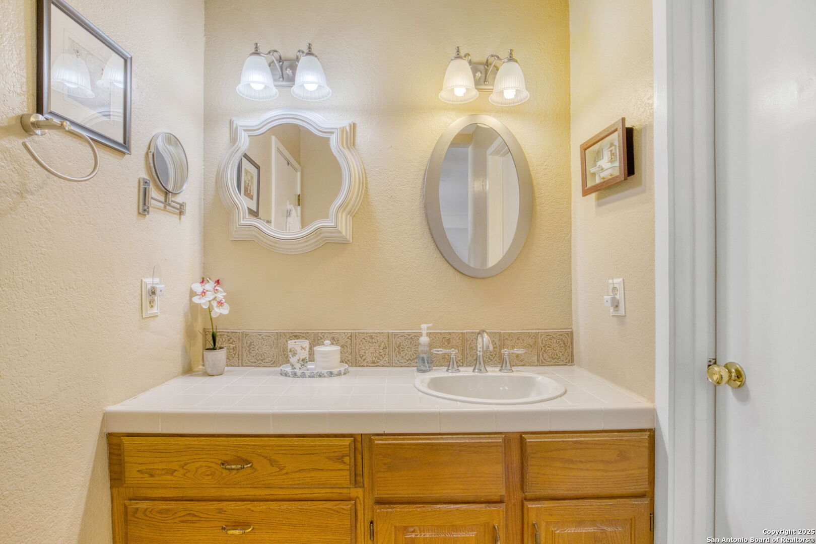 805 Highway 534 Loop, Unit 122 Kerrville, TX 78028 - Photo 7 of 30 a bathroom with a granite countertop sink mirror and vanity