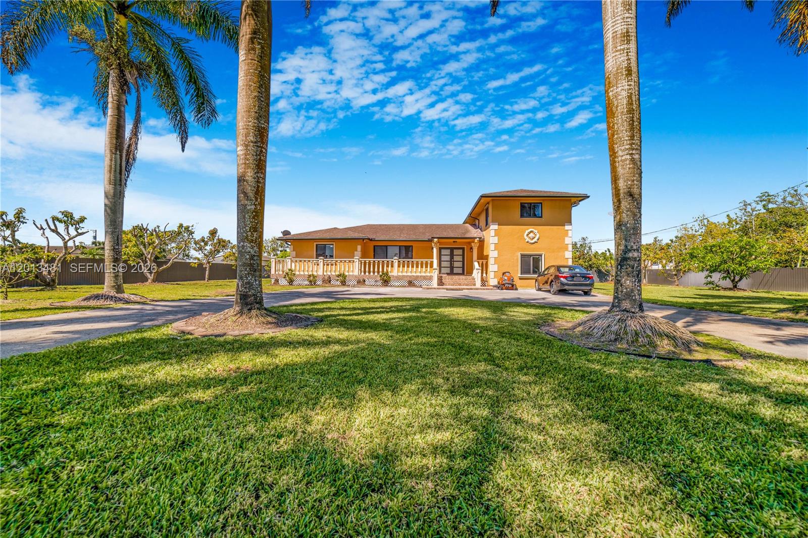 26500 Southwest 167th Avenue Homestead, FL 33031 - Photo 1 of 78 a front view of a house with a yard