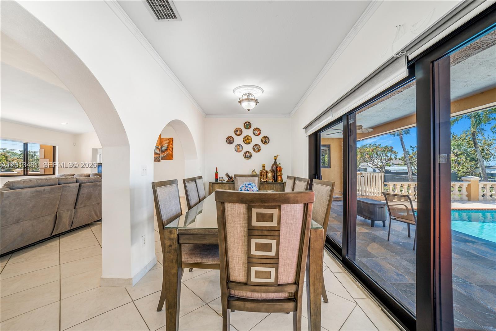 26500 Southwest 167th Avenue Homestead, FL 33031 - Photo 13 of 78 a view of a dining room with furniture window and outside view