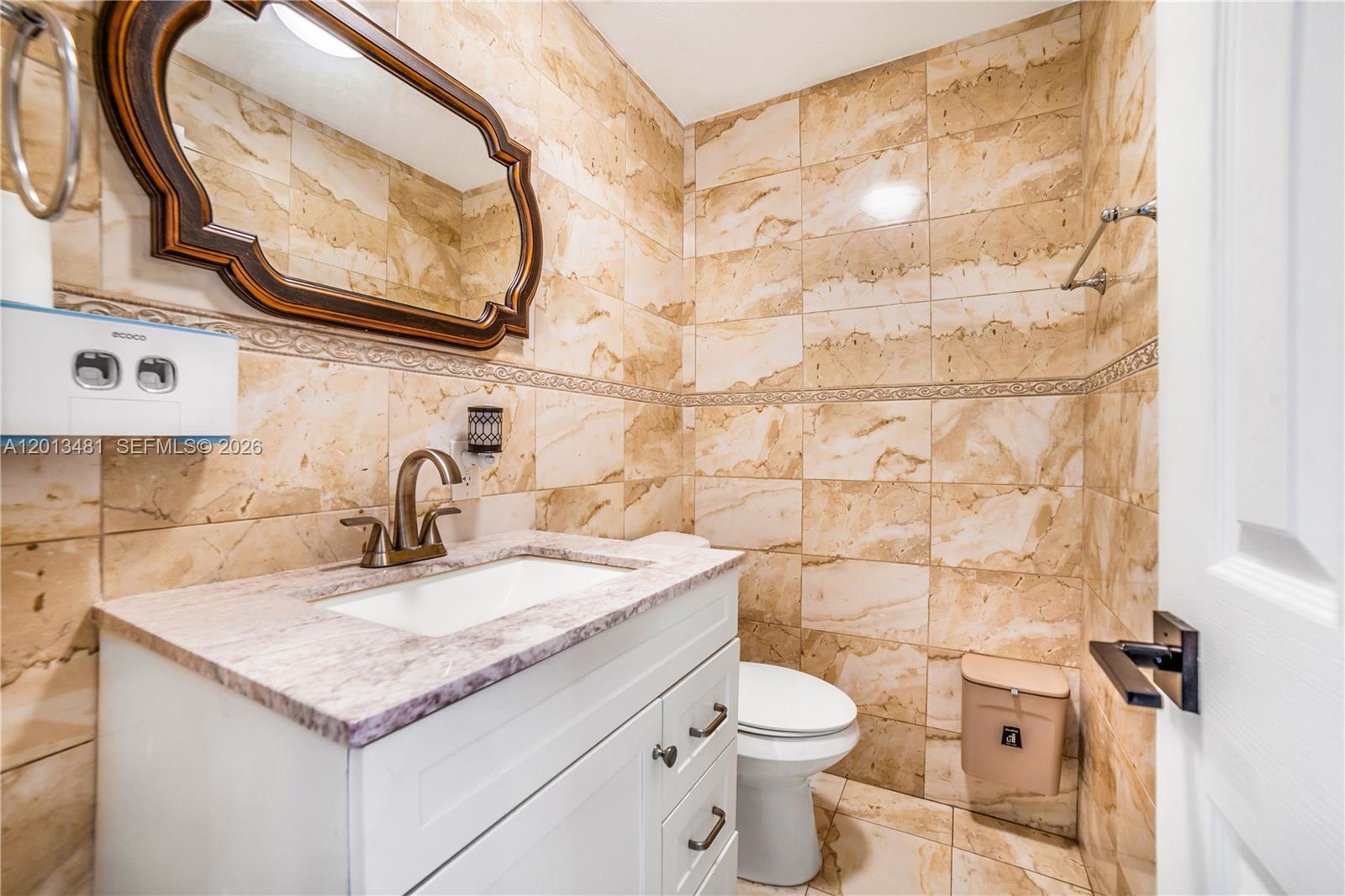 26500 Southwest 167th Avenue Homestead, FL 33031 - Photo 24 of 78 a bathroom with a granite countertop sink and a mirror