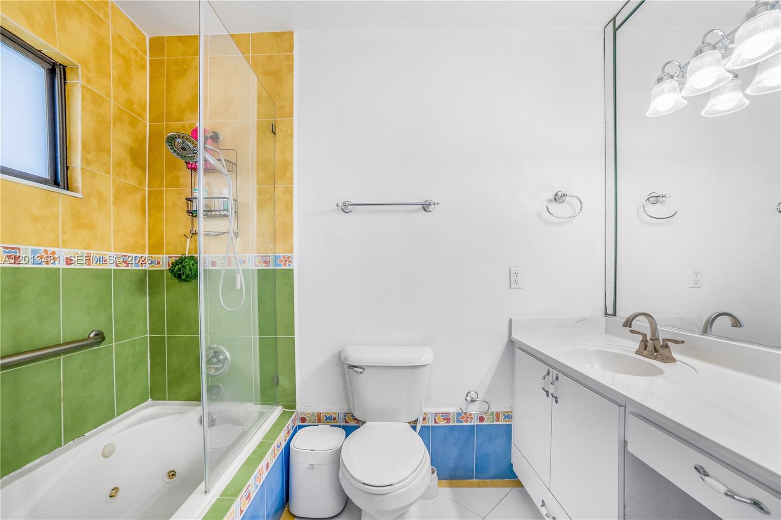 26500 Southwest 167th Avenue Homestead, FL 33031 - Photo 28 of 78 a bathroom with a sink mirror toilet and bathtub