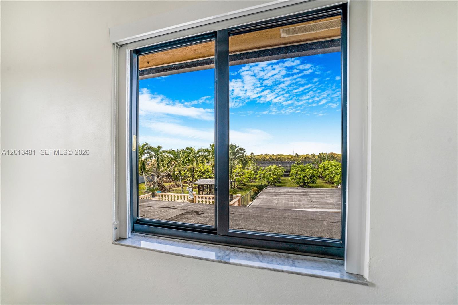 26500 Southwest 167th Avenue Homestead, FL 33031 - Photo 29 of 78 a view of a glass door and a window