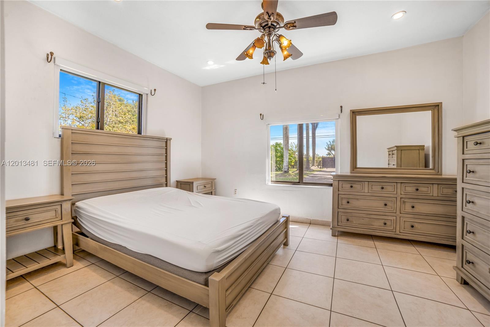 26500 Southwest 167th Avenue Homestead, FL 33031 - Photo 39 of 78 a bedroom with a bed and a dresser