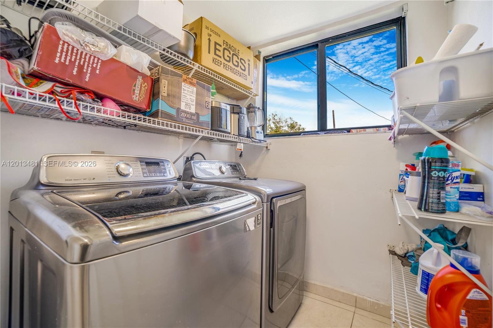26500 Southwest 167th Avenue Homestead, FL 33031 - Photo 40 of 78 a utility room with lots of clutter and cabinets