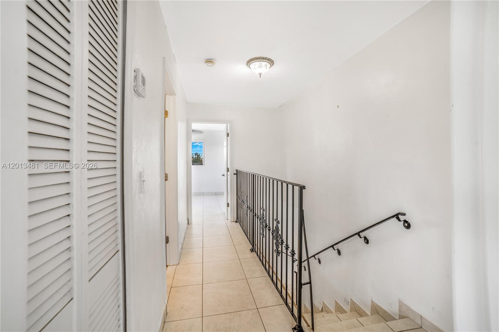 26500 Southwest 167th Avenue Homestead, FL 33031 - Photo 46 of 78 a view of a hallway with a white walls