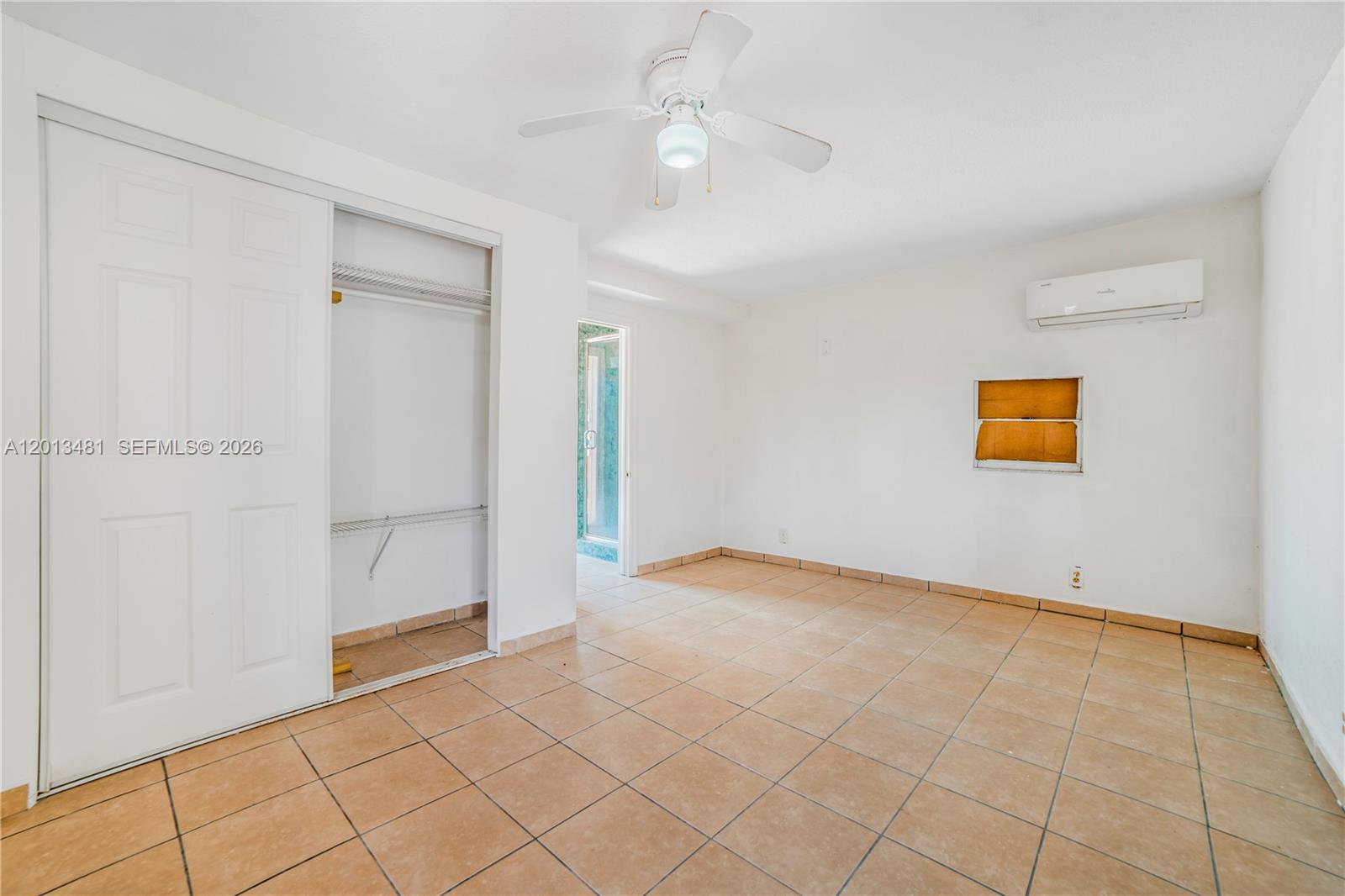 26500 Southwest 167th Avenue Homestead, FL 33031 - Photo 48 of 78 an empty room with closet and windows
