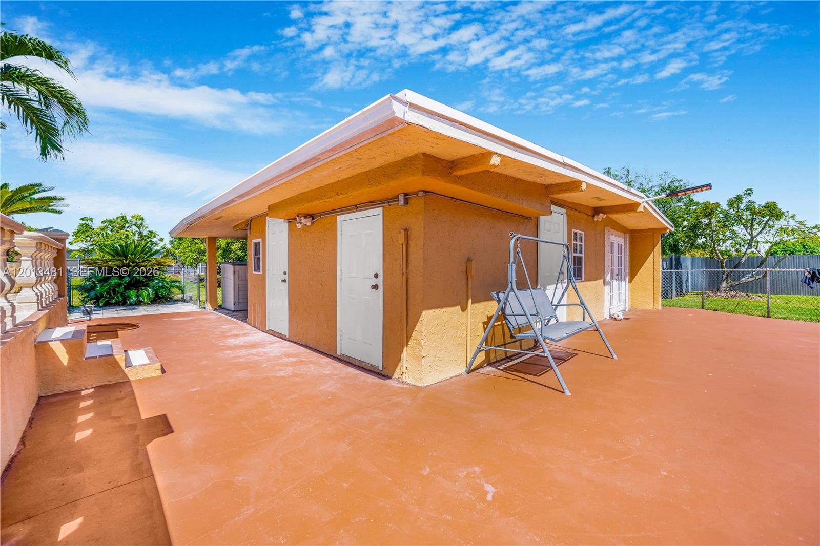 26500 Southwest 167th Avenue Homestead, FL 33031 - Photo 54 of 78 a view of backyard with a patio