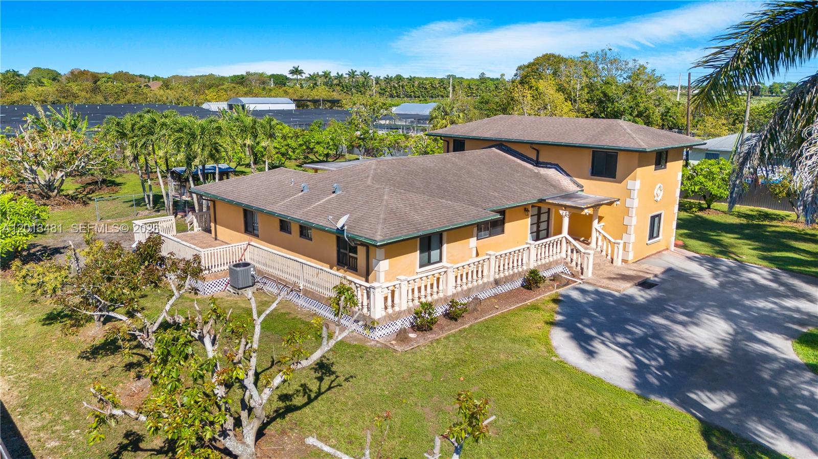 26500 Southwest 167th Avenue Homestead, FL 33031 - Photo 7 of 78 an aerial view of a house with a big yard