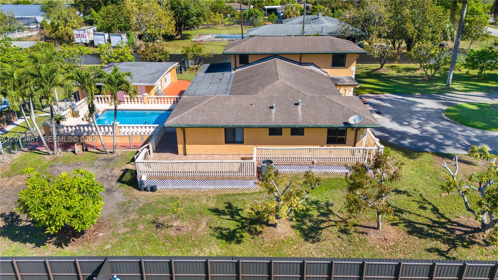26500 Southwest 167th Avenue Homestead, FL 33031 - Photo 71 of 78 a aerial view of a house with swimming pool garden and patio