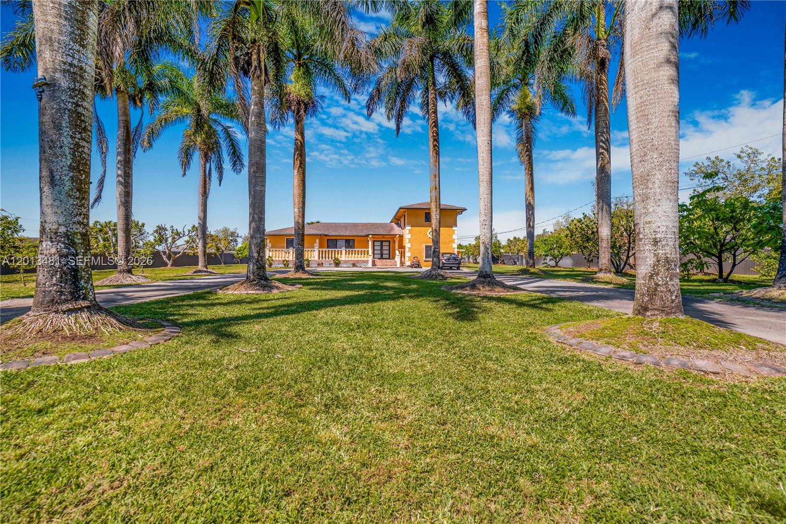 26500 Southwest 167th Avenue Homestead, FL 33031 - Photo 73 of 78 a view of a swimming pool with palm trees