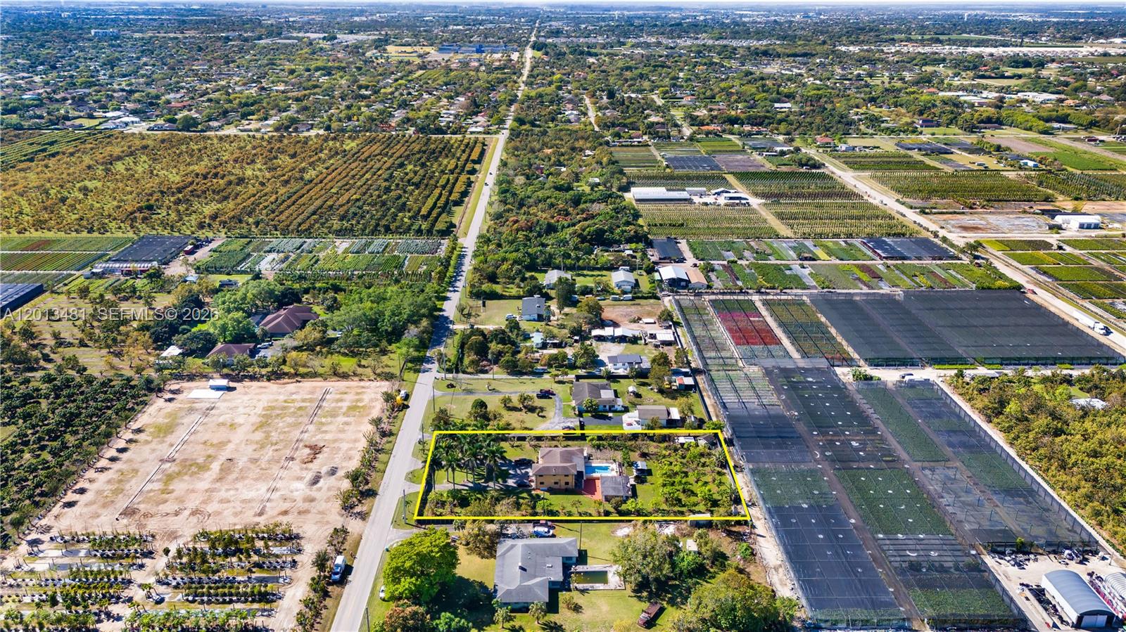 26500 Southwest 167th Avenue Homestead, FL 33031 - Photo 77 of 78 an aerial view of residential houses with outdoor space