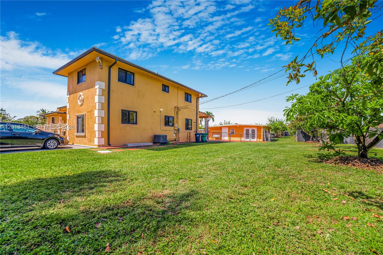 26500 Southwest 167th Avenue Homestead, FL 33031 - Photo 8 of 78 a front view of a house with garden