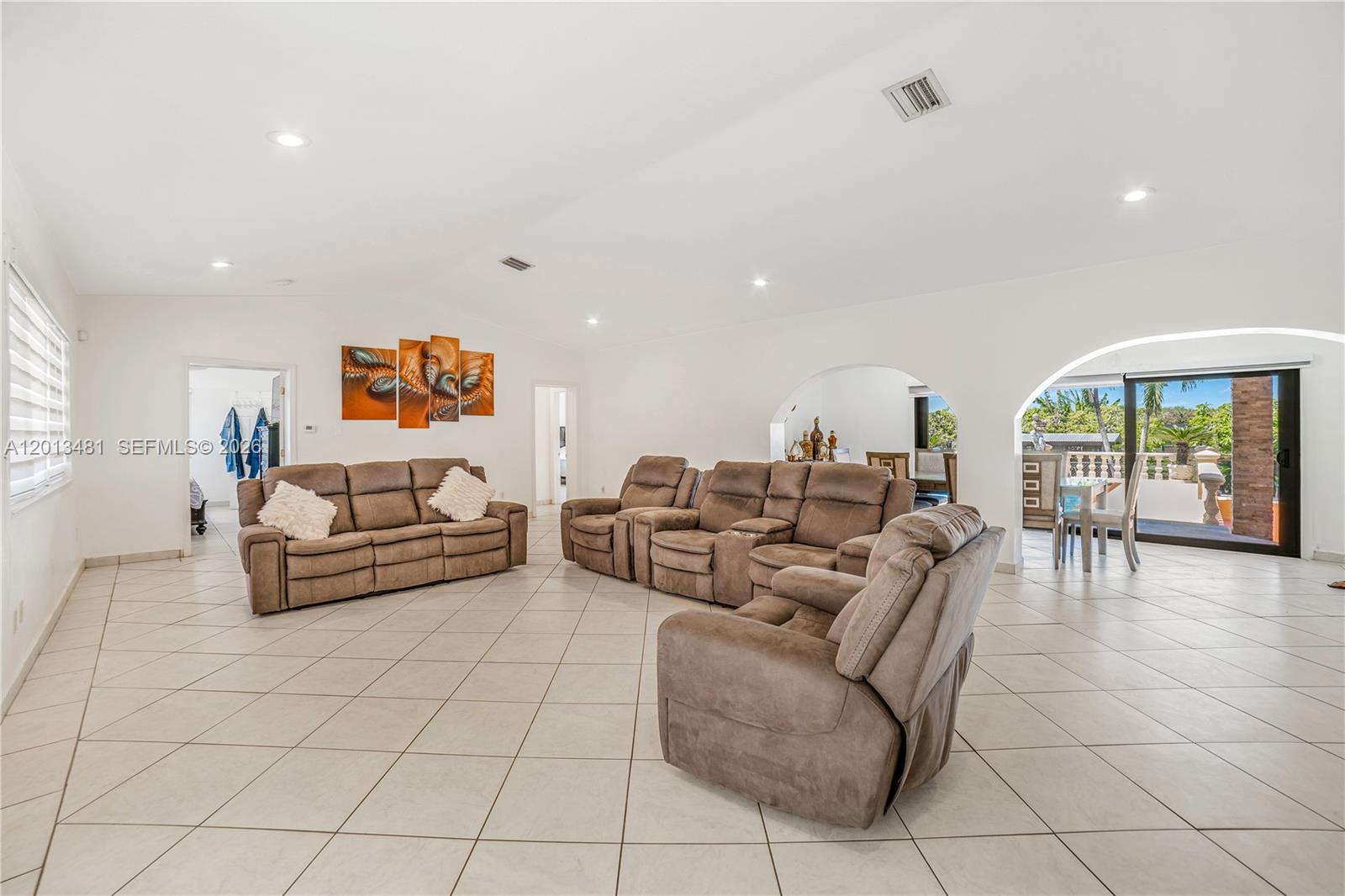 26500 Southwest 167th Avenue Homestead, FL 33031 - Photo 10 of 78 a living room with furniture and a table