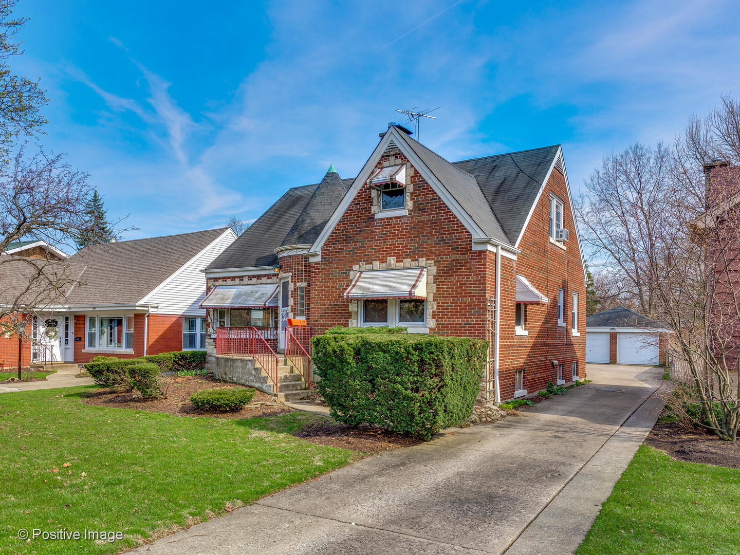 399 Longcommon Road Riverside, IL 60546 - Photo 1 of 25 a front view of a house with a yard