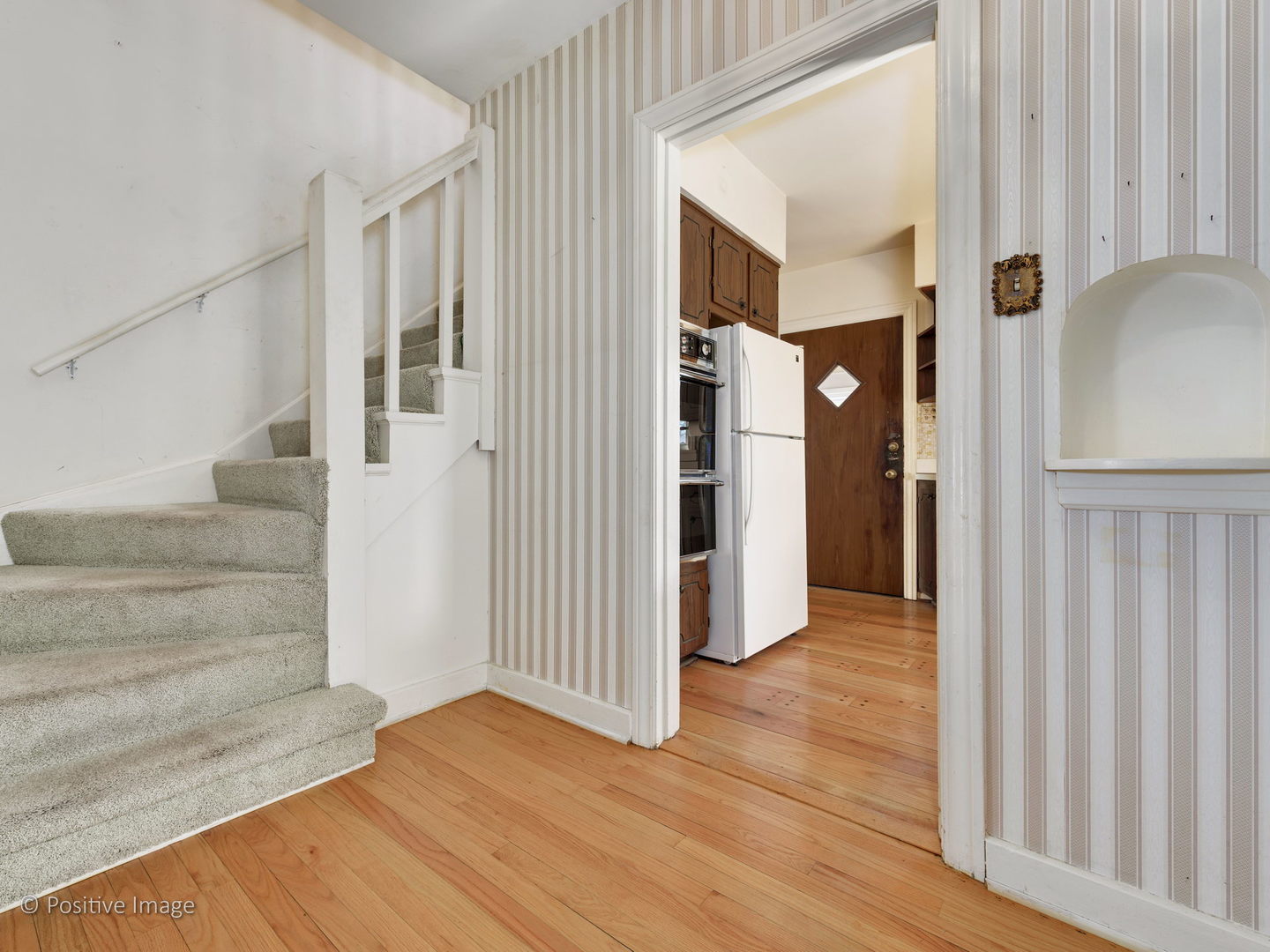 399 Longcommon Road Riverside, IL 60546 - Photo 11 of 25 a view of a hallway with wooden floor and entryway