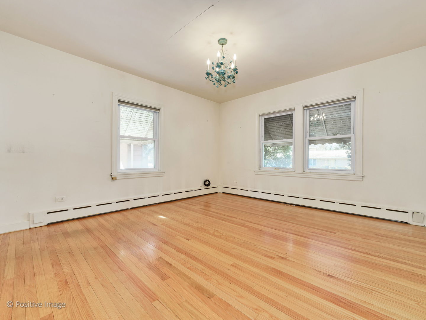 399 Longcommon Road Riverside, IL 60546 - Photo 12 of 25 a view of an empty room with a window and wooden floor