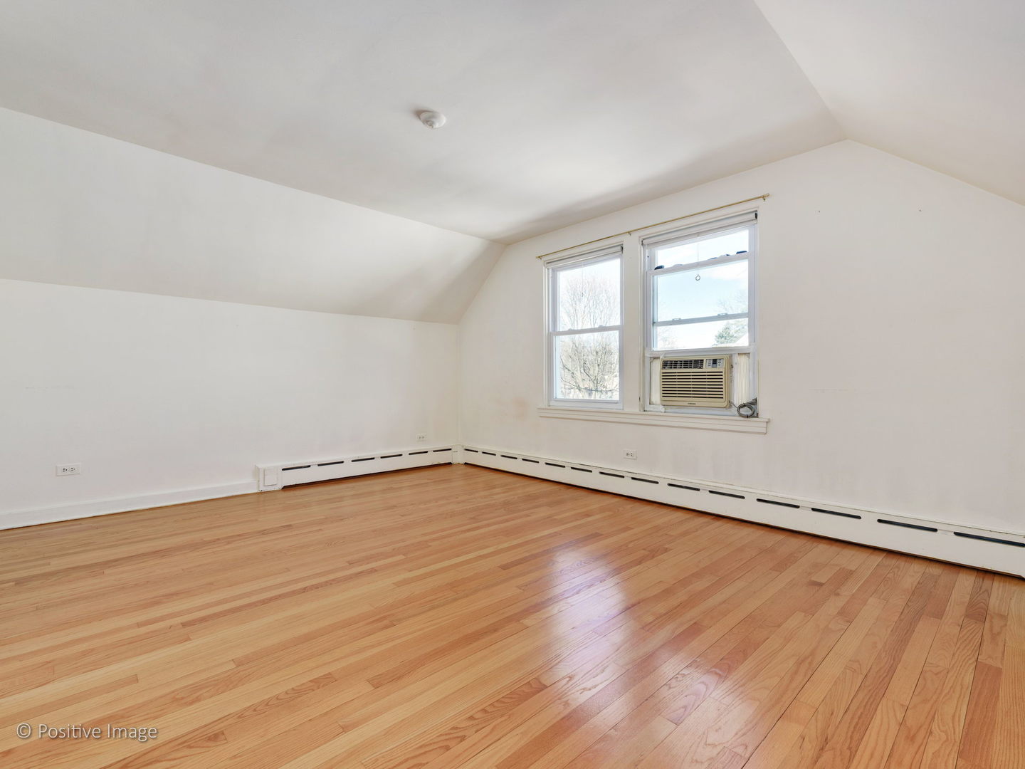 399 Longcommon Road Riverside, IL 60546 - Photo 13 of 25 an empty room with wooden floor and windows