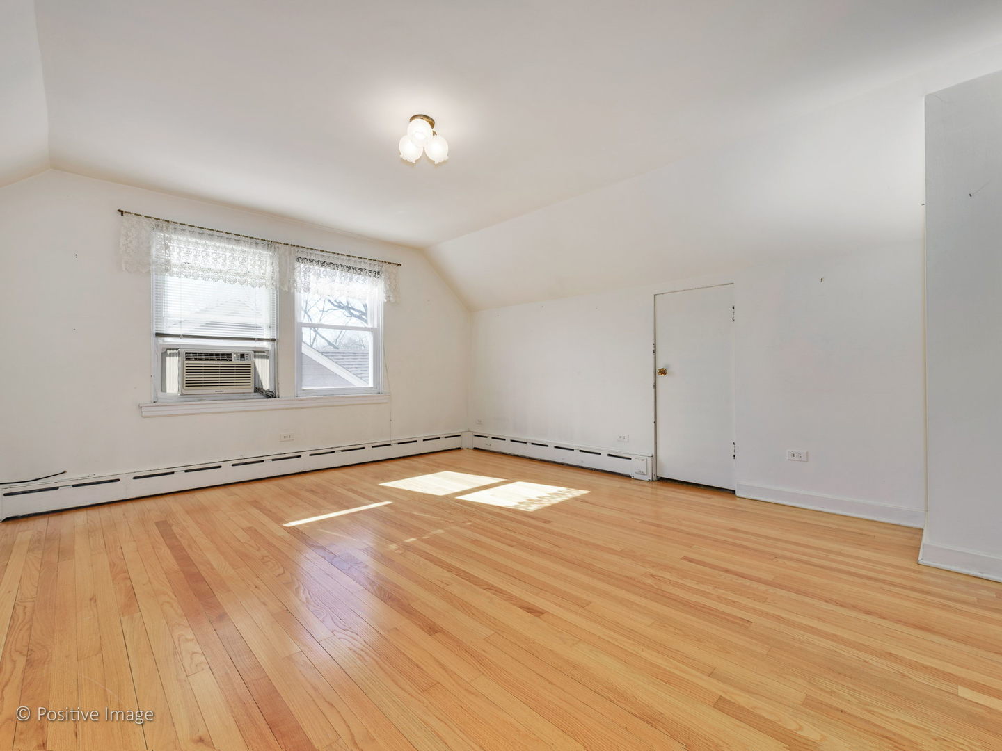 399 Longcommon Road Riverside, IL 60546 - Photo 14 of 25 an empty room with wooden floor and windows