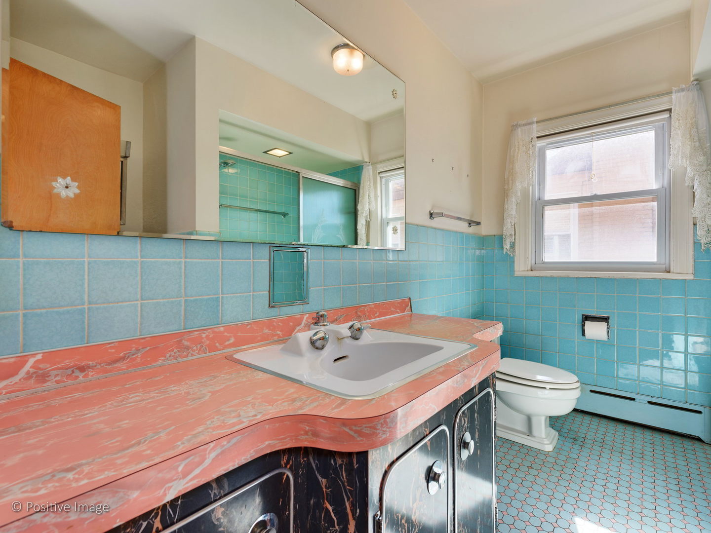 399 Longcommon Road Riverside, IL 60546 - Photo 16 of 25 a bathroom with a sink a toilet and mirror