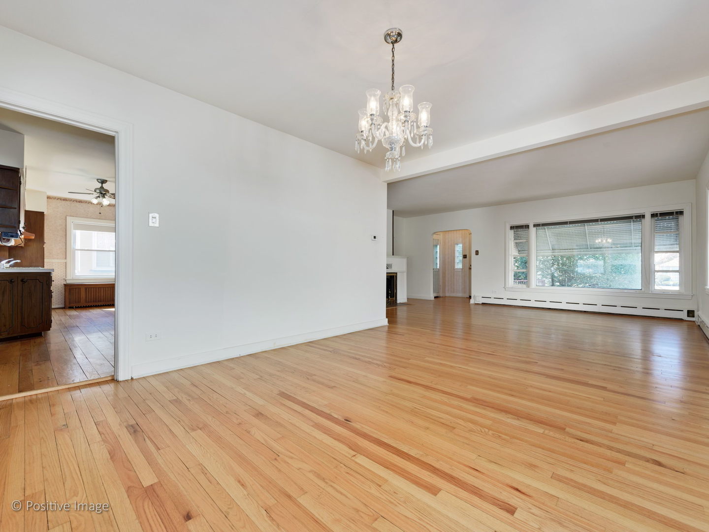 399 Longcommon Road Riverside, IL 60546 - Photo 7 of 25 a view of empty room with wooden floor and fan
