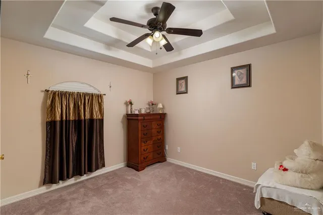 a view of room with furniture and ceiling fan