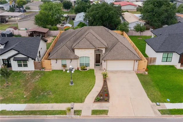 a aerial view of a house with a yard