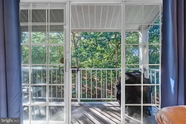 a view of a room with a large window